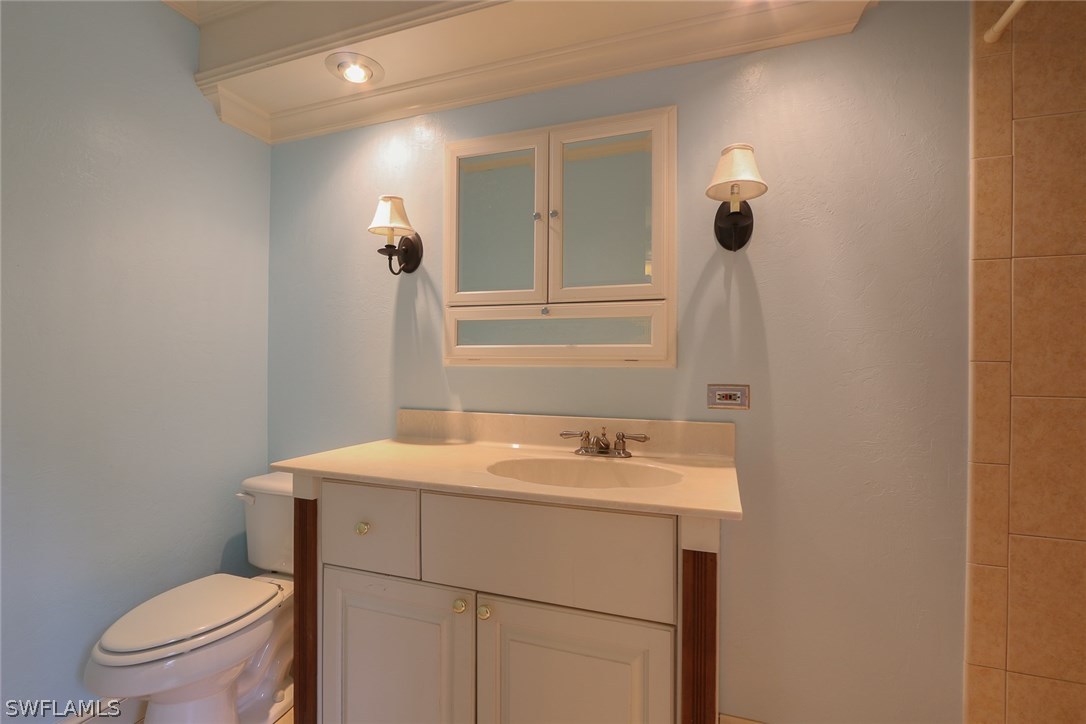 8430 Cardinal Road Fort Myers, FL 33967 - Photo 13 of 19 a bathroom with a sink and a toilet