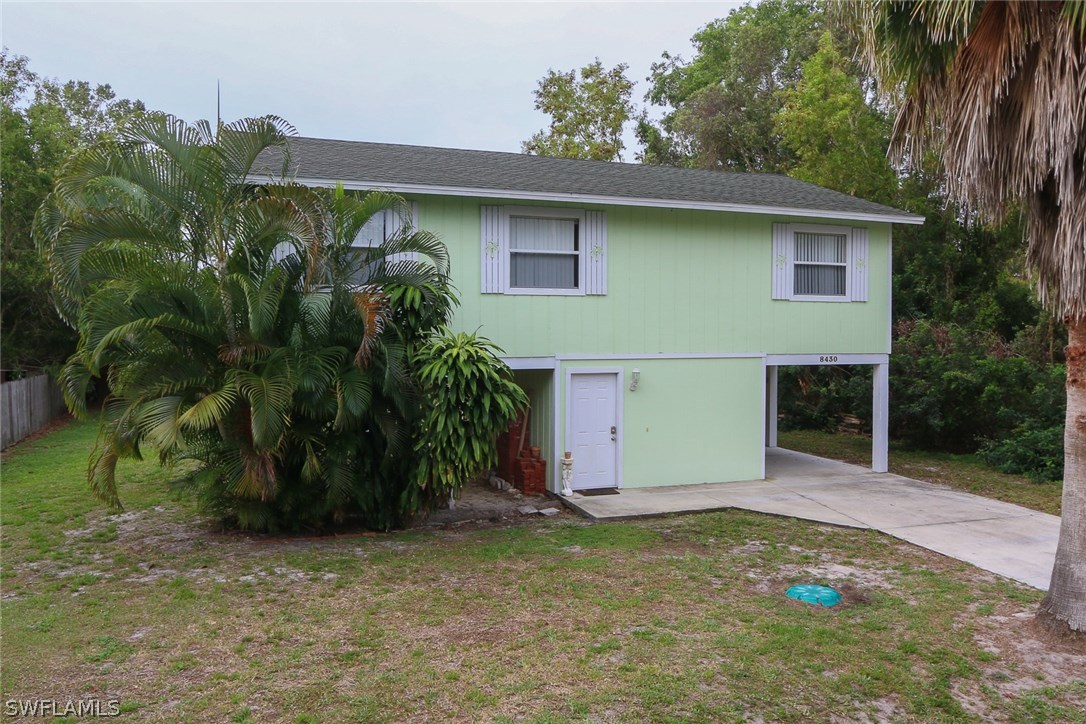 8430 Cardinal Road Fort Myers, FL 33967 - Photo 3 of 19 a front view of house with yard