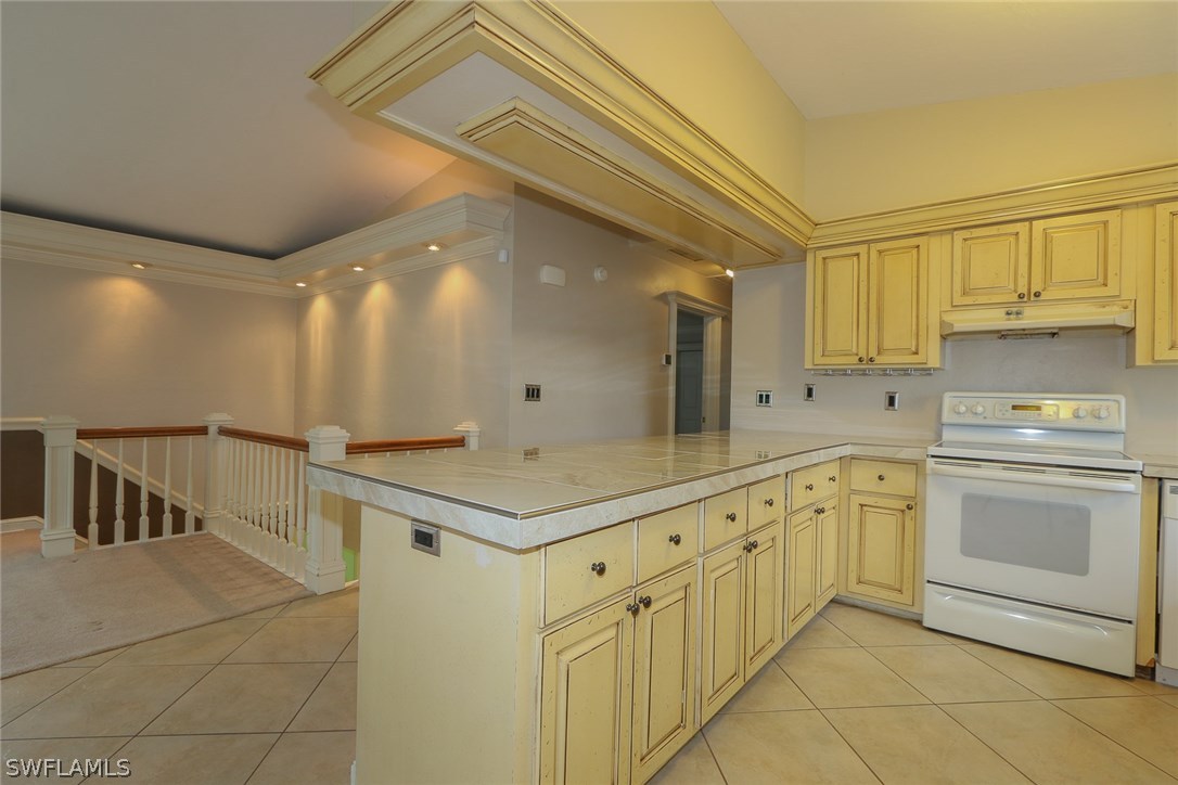 8430 Cardinal Road Fort Myers, FL 33967 - Photo 6 of 19 a kitchen with granite countertop a sink and cabinets