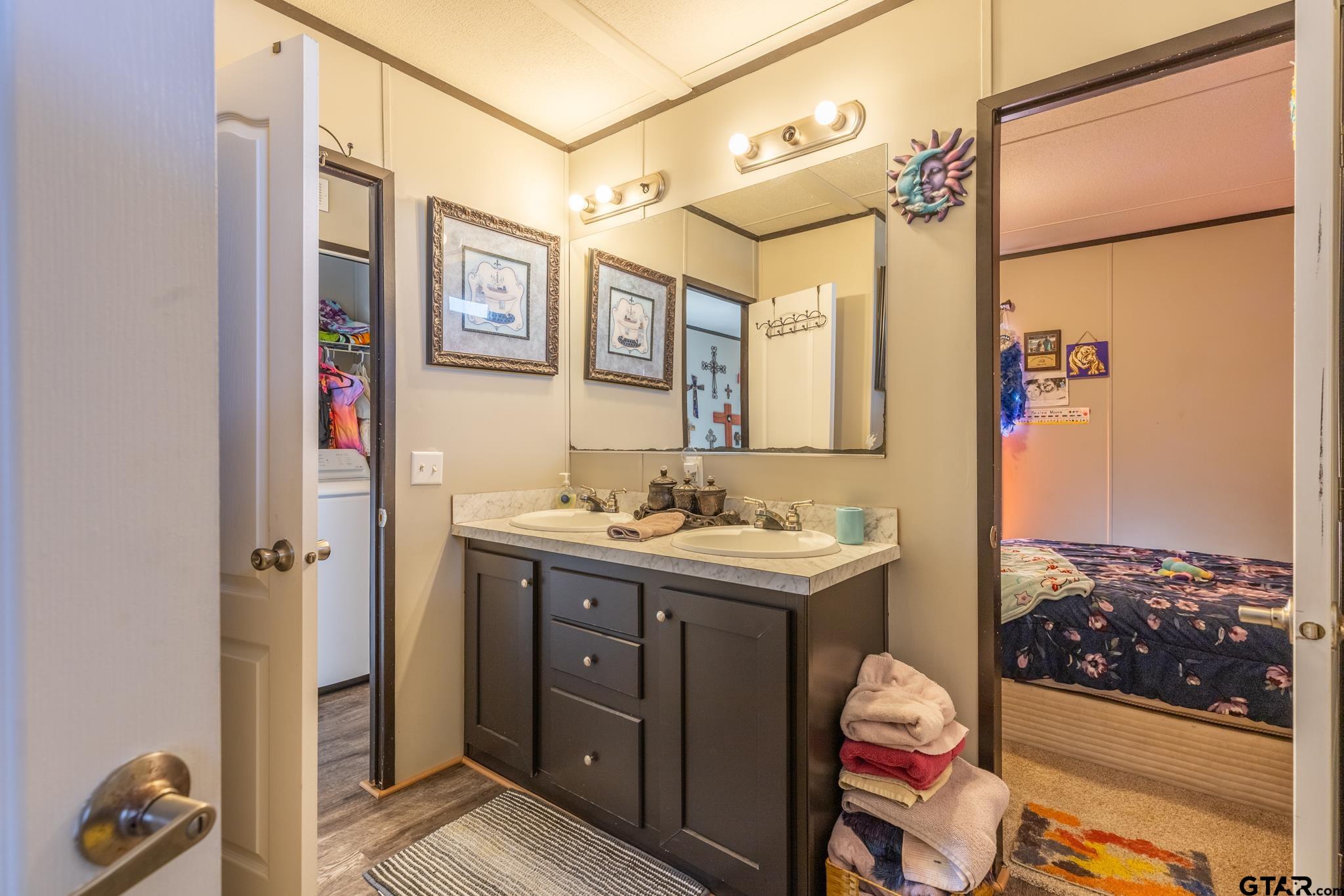 182 Sioux Quitman, TX 75783 - Photo 14 of 14 a view of bathroom with a sink a mirror and a shower