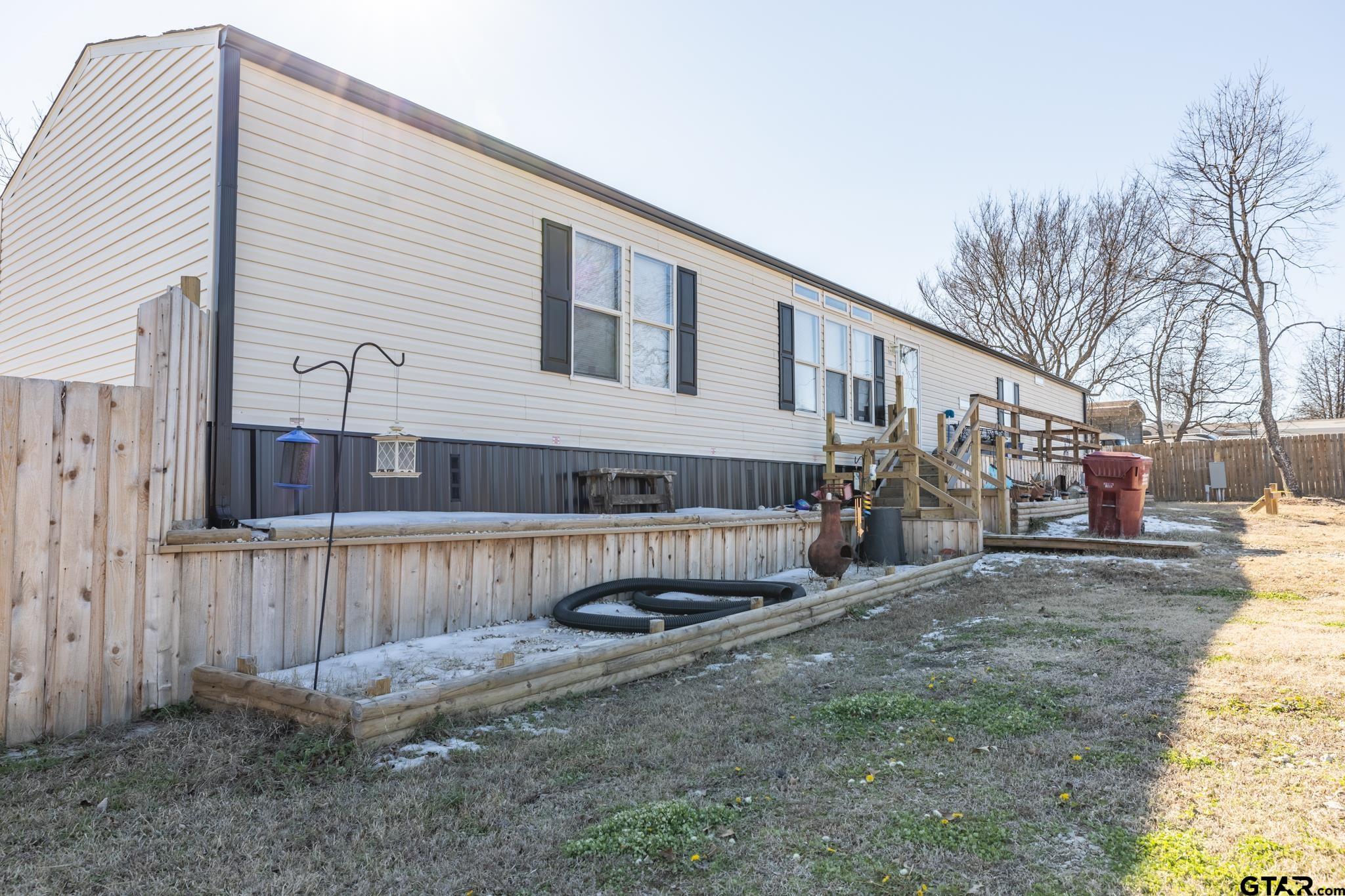 182 Sioux Quitman, TX 75783 - Photo 2 of 14 a view of a house with a patio