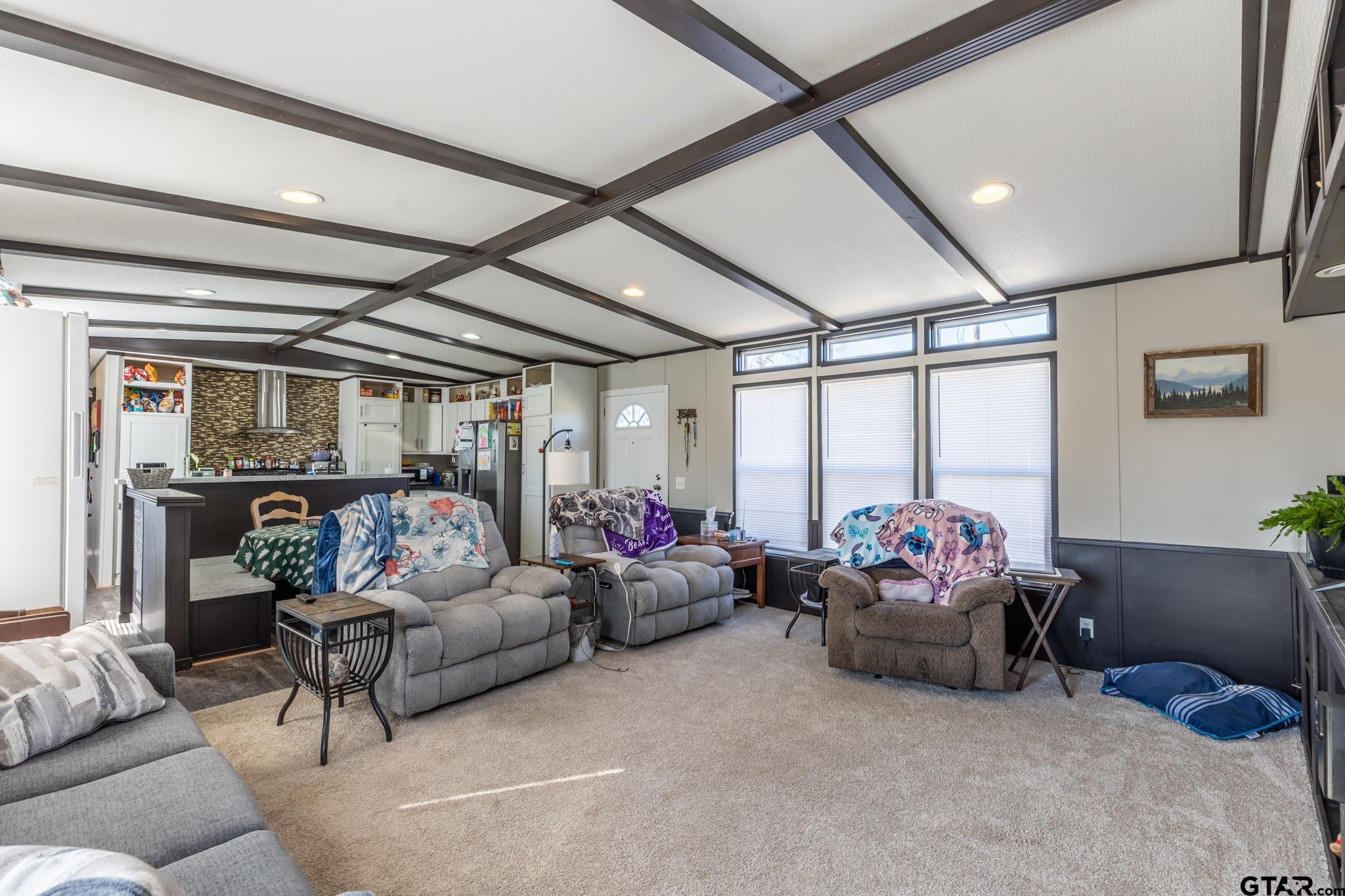 182 Sioux Quitman, TX 75783 - Photo 5 of 14 a living room with furniture and a chandelier