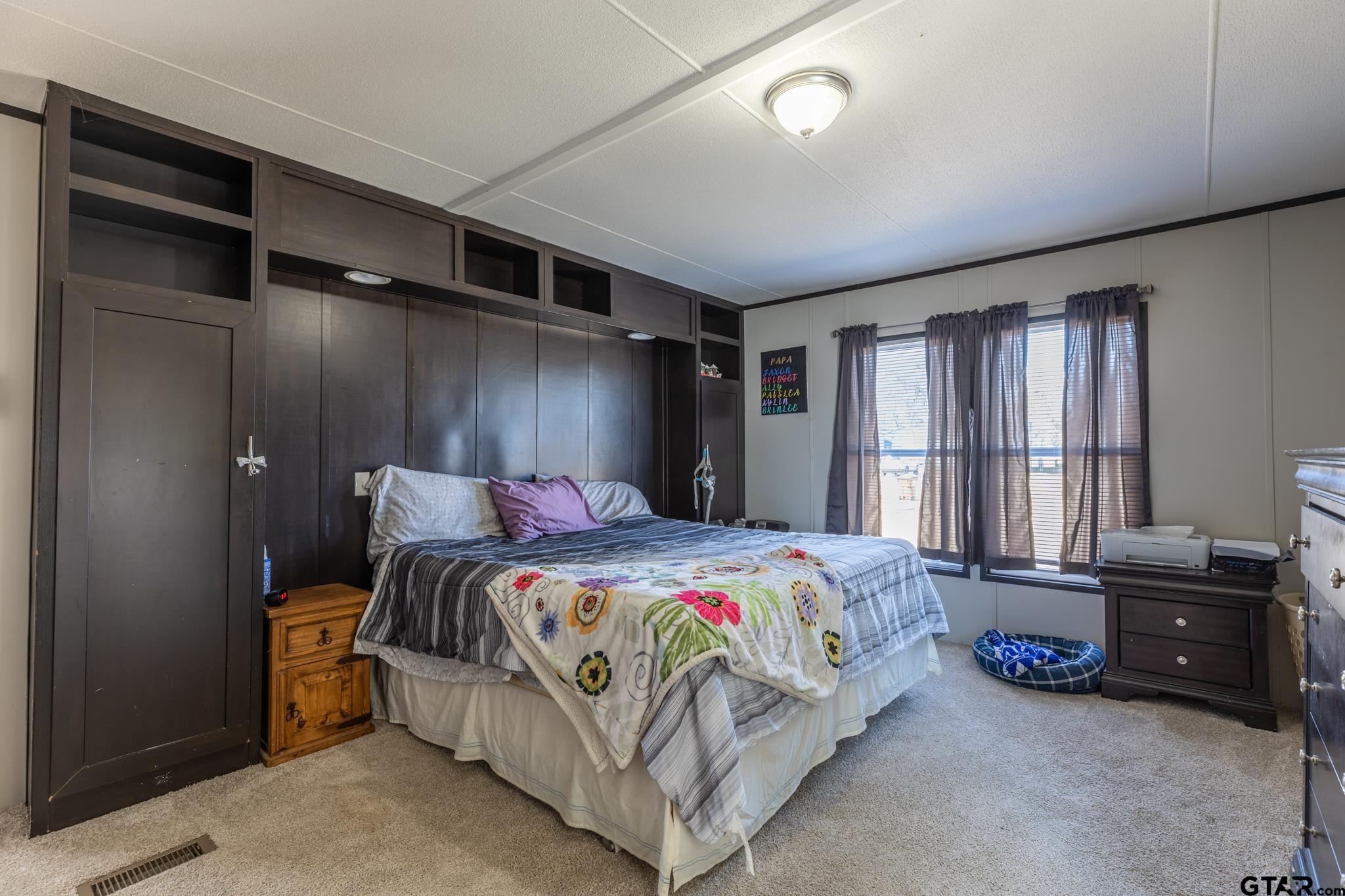 182 Sioux Quitman, TX 75783 - Photo 8 of 14 a bedroom with a bed and a window