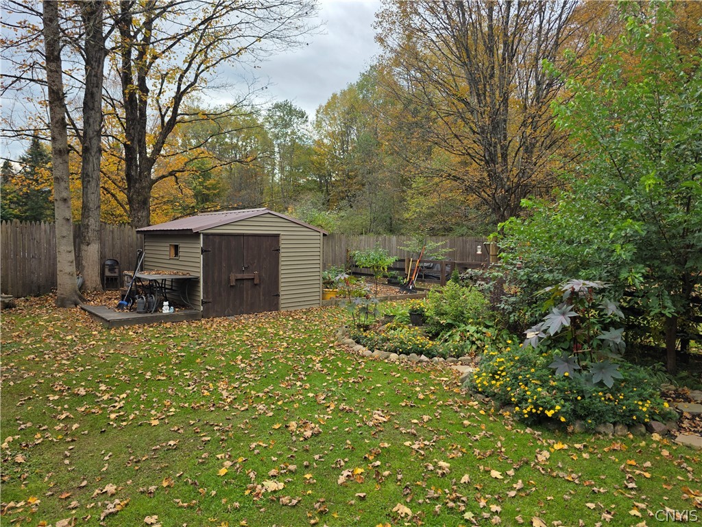 1053 Grant Road Russia, NY 13324 - Photo 41 of 47 Mature trees frame a spacious grassy backyard comp