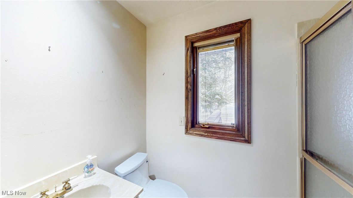 1091 Sand Run Road Akron, OH 44313 - Photo 14 of 26 There's a full bath with walk-in shower on the first floor near 2 car attached garage.