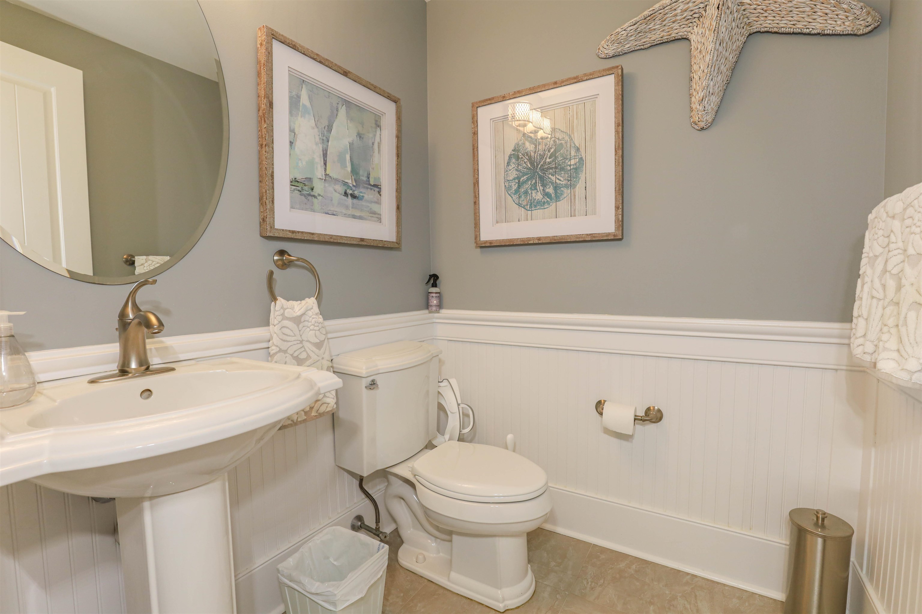 7701 Atlantic Avenue, Unit 102 Wildwood Crest, NJ 08260 - Photo 12 of 25 a bathroom with a toilet a sink and mirror