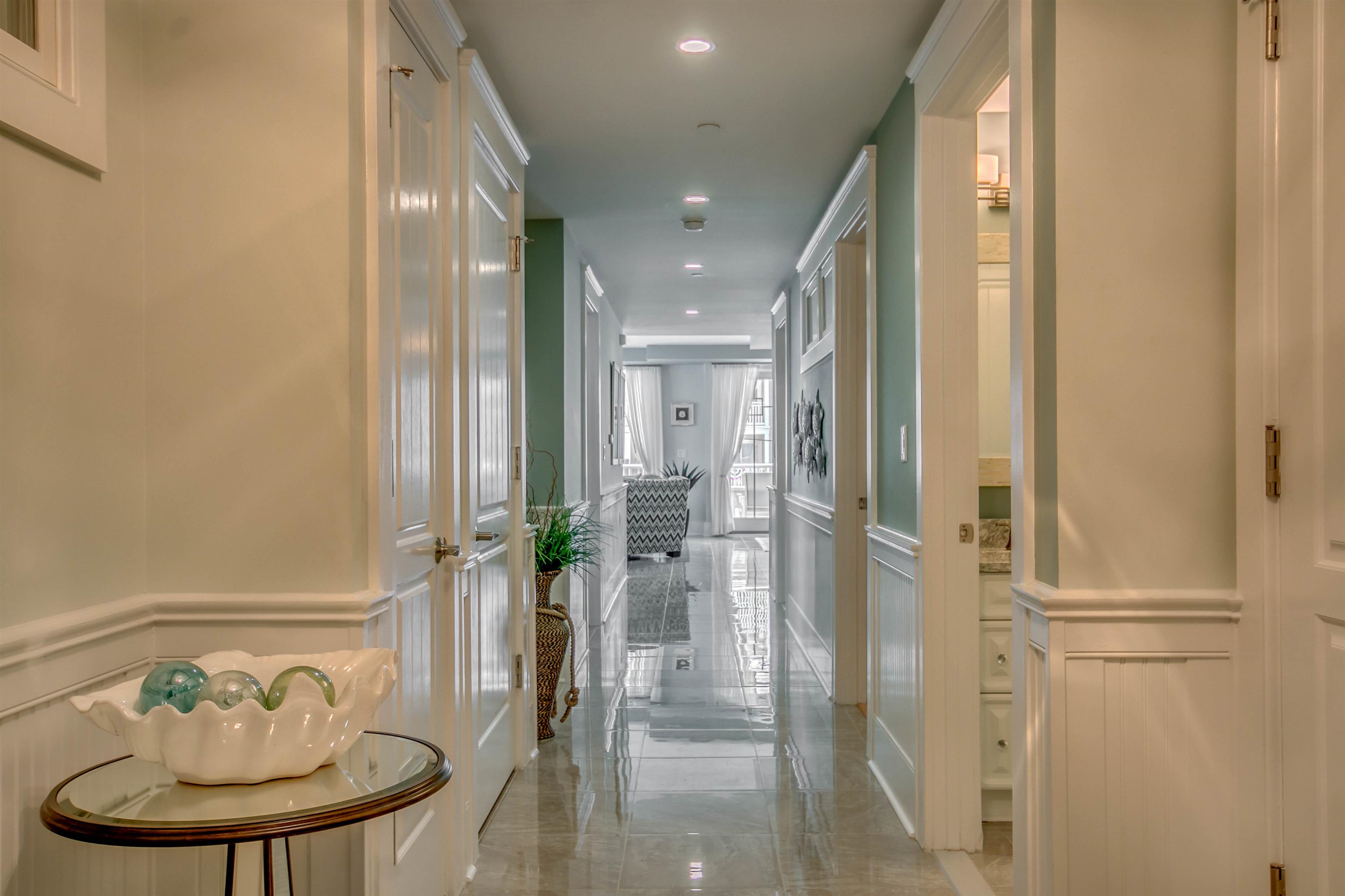 7701 Atlantic Avenue, Unit 102 Wildwood Crest, NJ 08260 - Photo 2 of 25 a bathroom with a sink and mirror