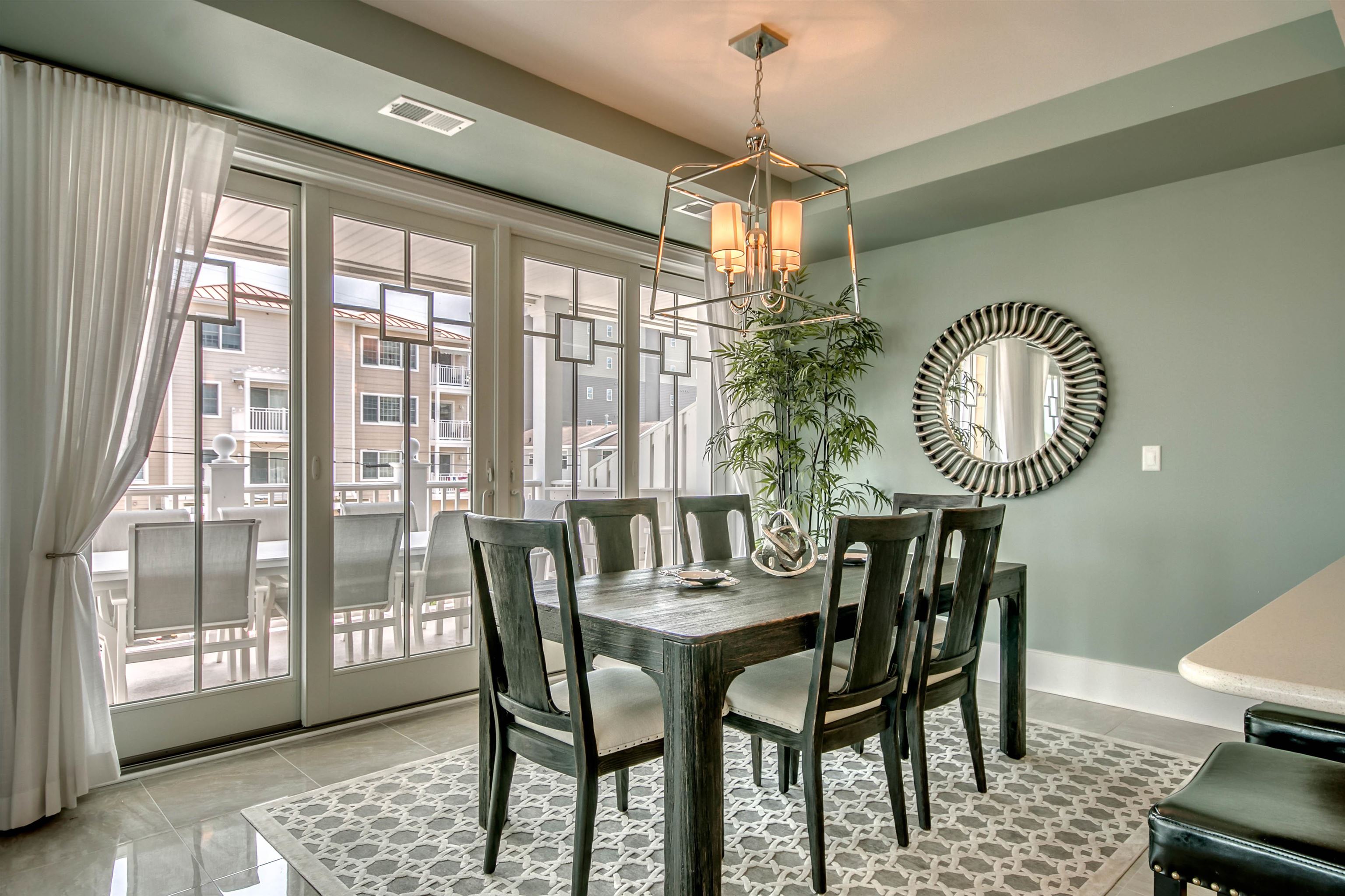 7701 Atlantic Avenue, Unit 102 Wildwood Crest, NJ 08260 - Photo 4 of 25 a view of a dining room with furniture window and outside view