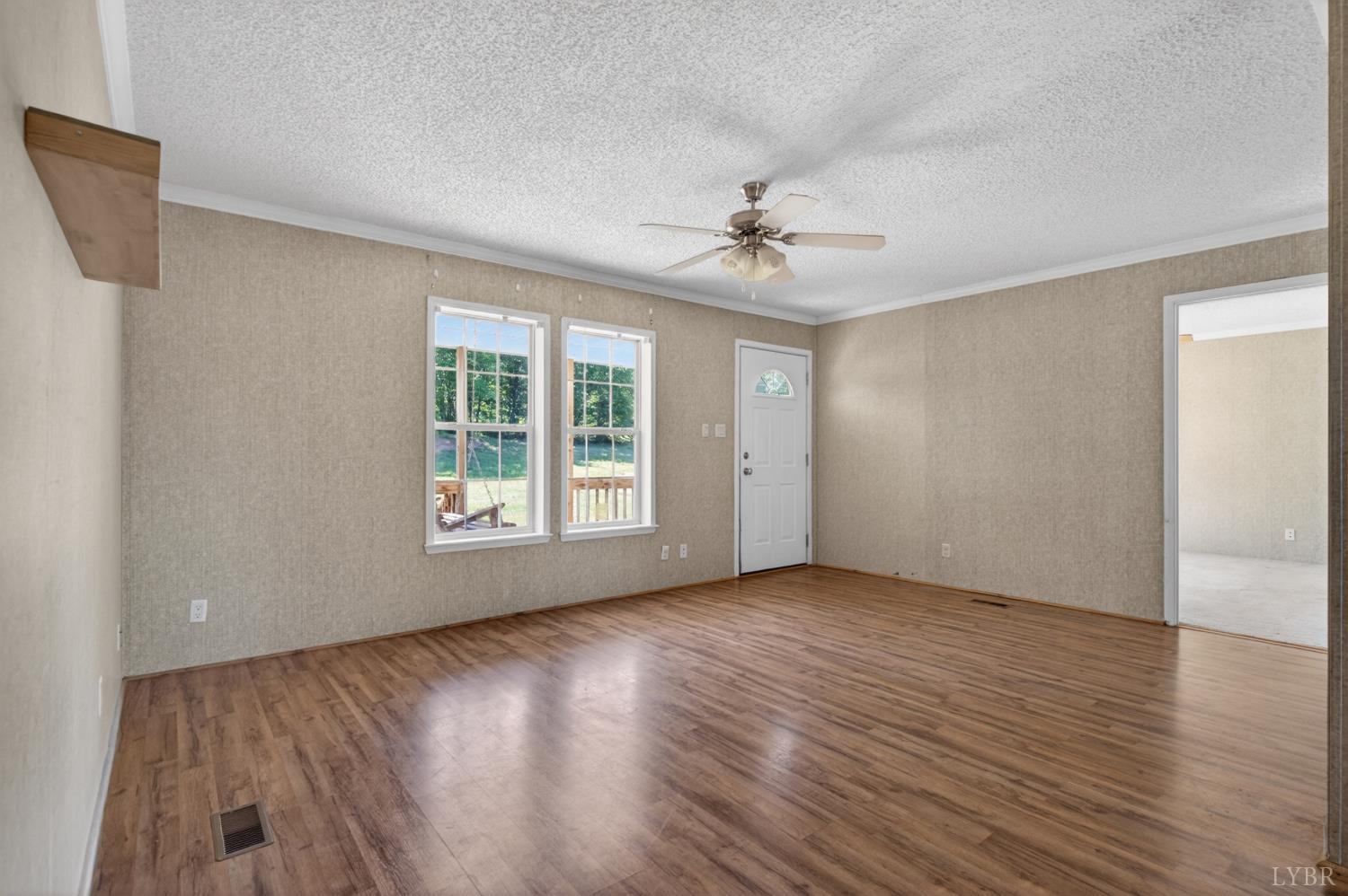 1811 Mohawk Road Gladys, VA 24554 - Photo 4 of 51 a view of room with window ceiling fan and hardwood floor