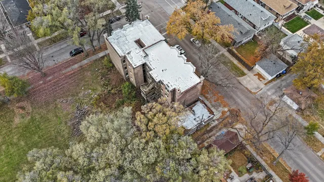 an aerial view of a house with a yard