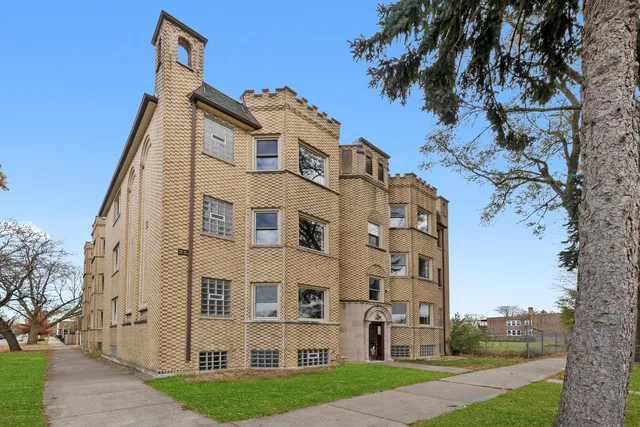 a view of a building with a yard