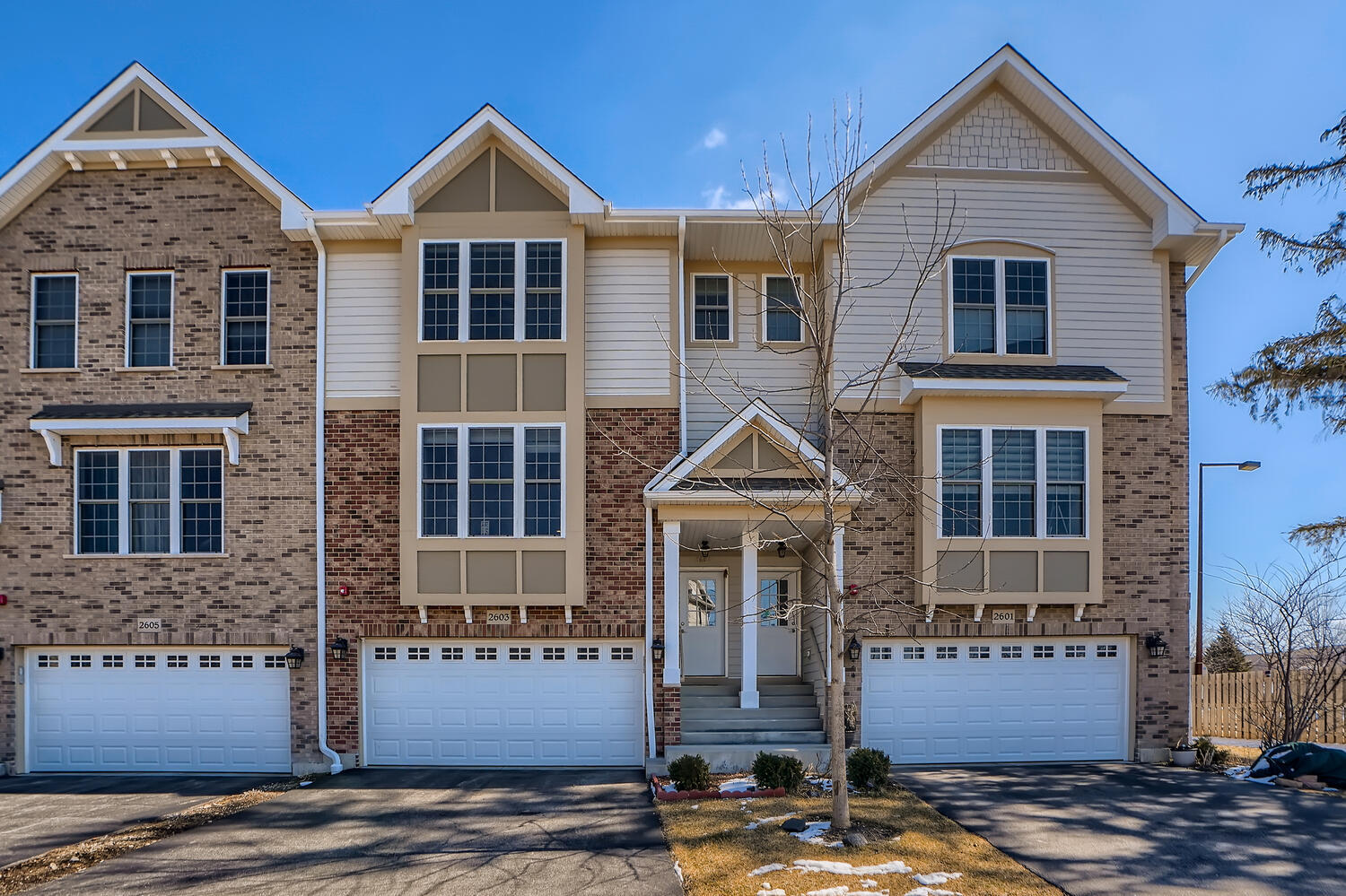 2603 Chelsey Street Buffalo Grove, IL 60089 - Photo 1 of 28 a front view of a house with a yard