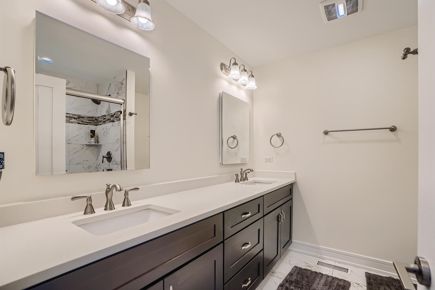 2603 Chelsey Street Buffalo Grove, IL 60089 - Photo 16 of 28 a bathroom with a double vanity sink and a mirror