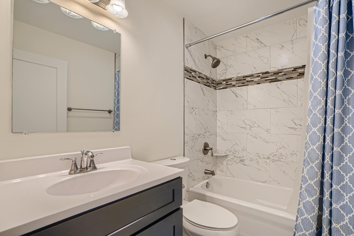 2603 Chelsey Street Buffalo Grove, IL 60089 - Photo 22 of 28 a bathroom with a granite countertop sink a toilet and shower