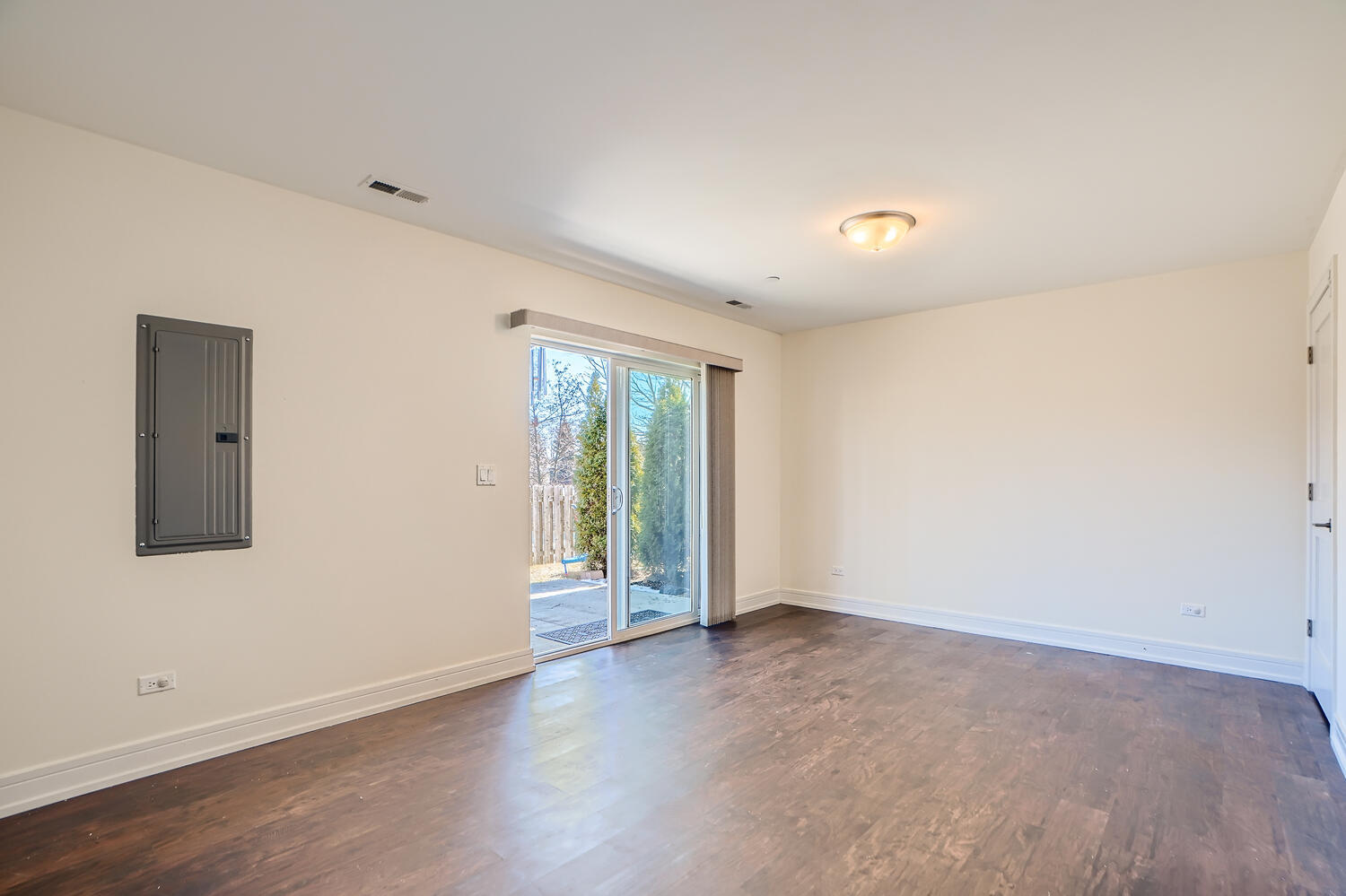 2603 Chelsey Street Buffalo Grove, IL 60089 - Photo 24 of 28 an empty room with wooden floor and windows