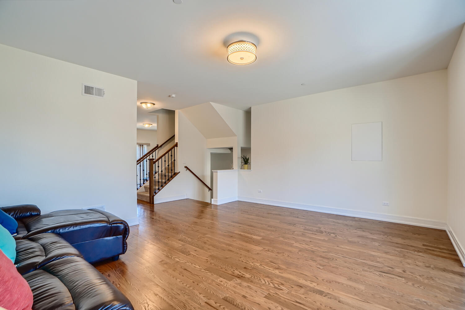 2603 Chelsey Street Buffalo Grove, IL 60089 - Photo 6 of 28 a view of empty room with wooden floor and fan