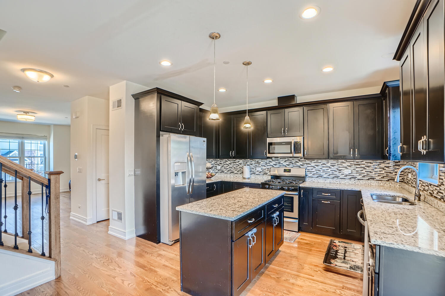 2603 Chelsey Street Buffalo Grove, IL 60089 - Photo 8 of 28 a kitchen with kitchen island stainless steel appliances a sink stove and refrigerator