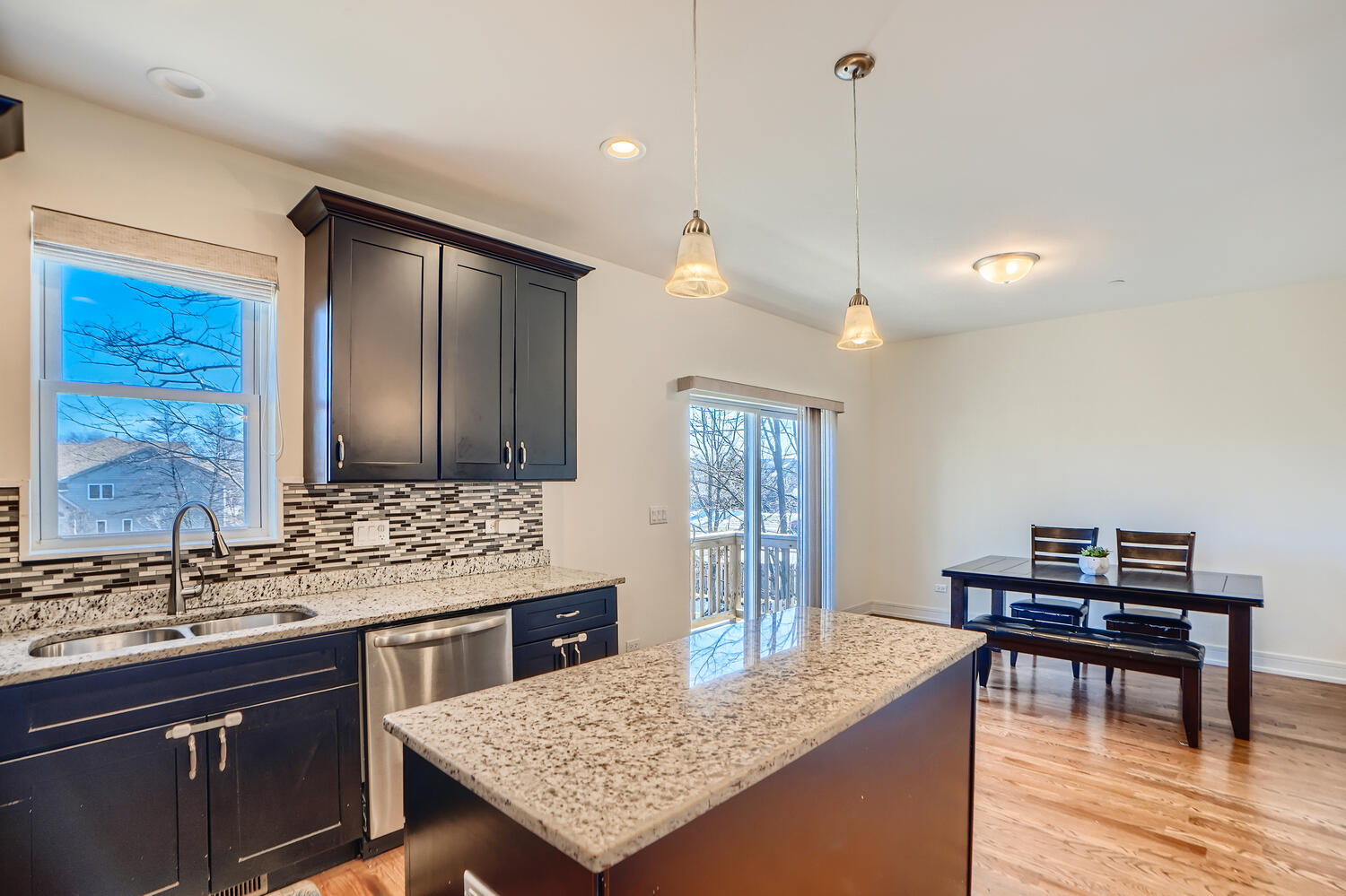 2603 Chelsey Street Buffalo Grove, IL 60089 - Photo 10 of 28 a kitchen with granite countertop cabinets and wooden floor