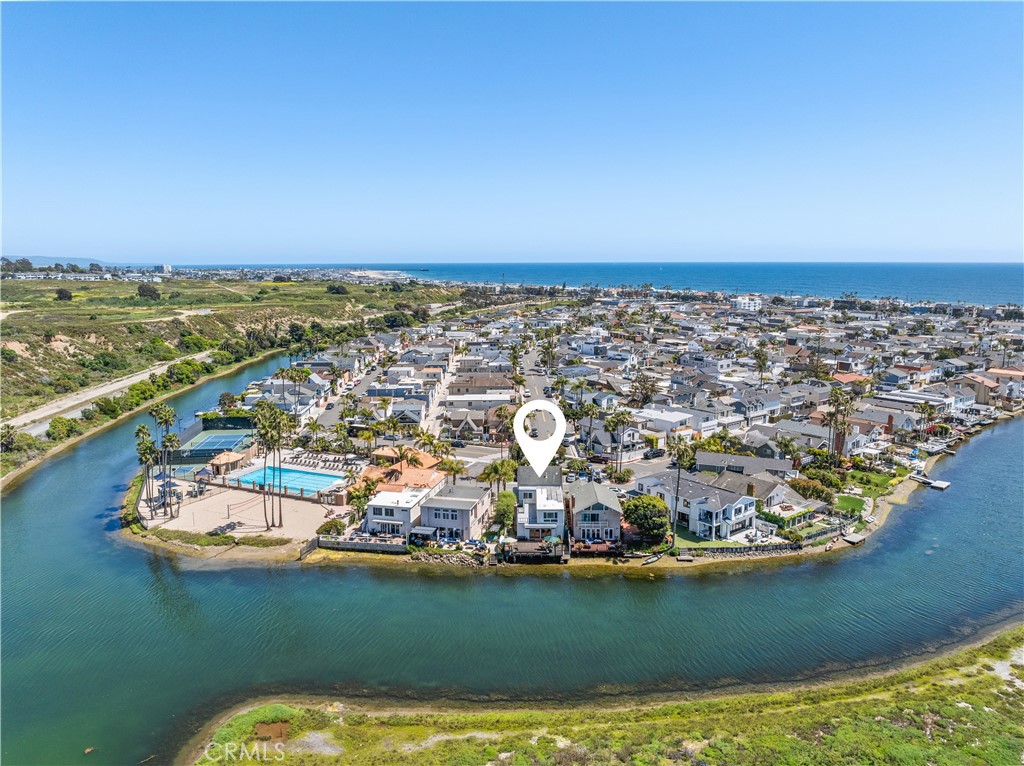 an aerial view of a house with a lake view