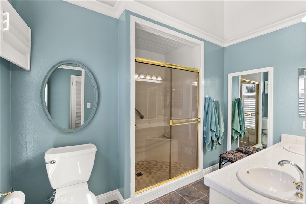 5 Canal Circle Newport Beach, CA 92663 - Photo 18 of 30 a bathroom with a toilet sink and mirror