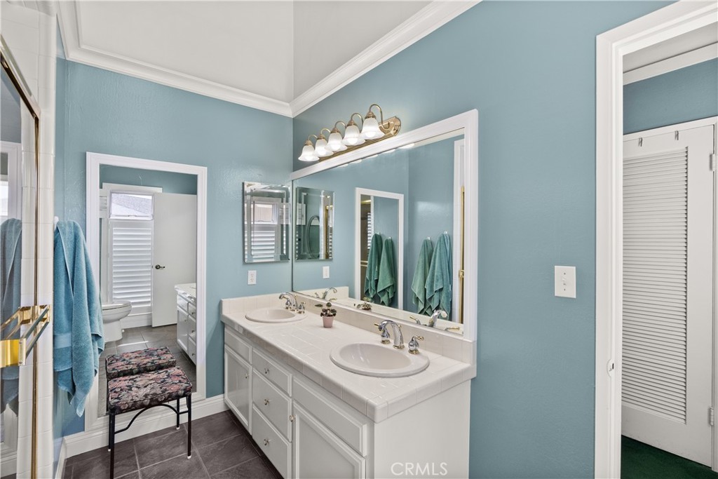 5 Canal Circle Newport Beach, CA 92663 - Photo 19 of 30 a bathroom with a sink double vanity and a mirror
