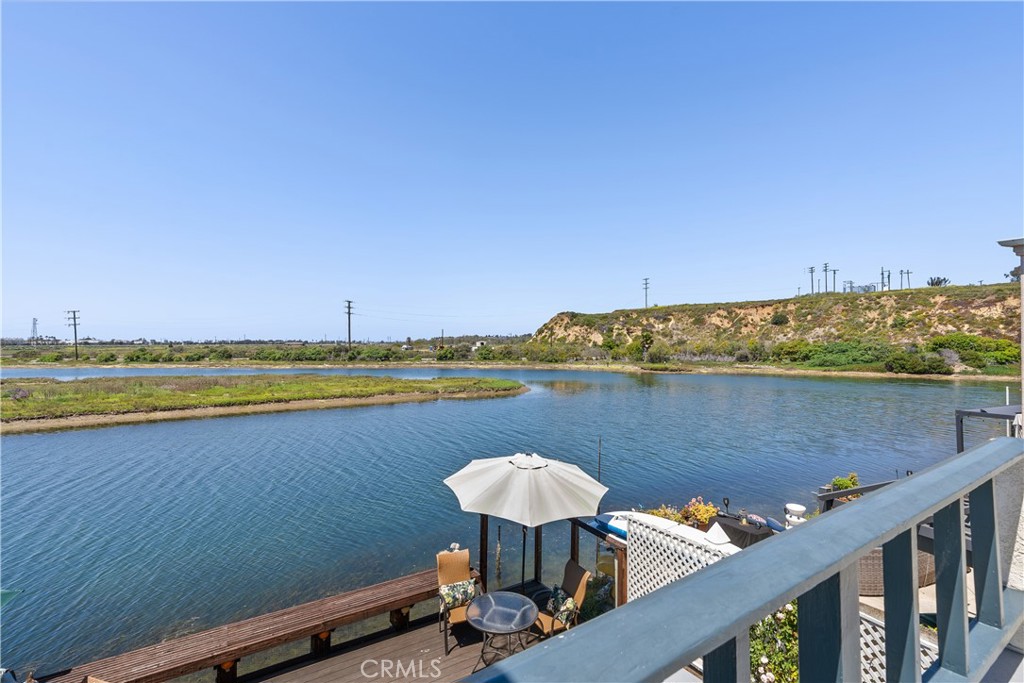 5 Canal Circle Newport Beach, CA 92663 - Photo 22 of 30 a view of a lake with a table and chairs