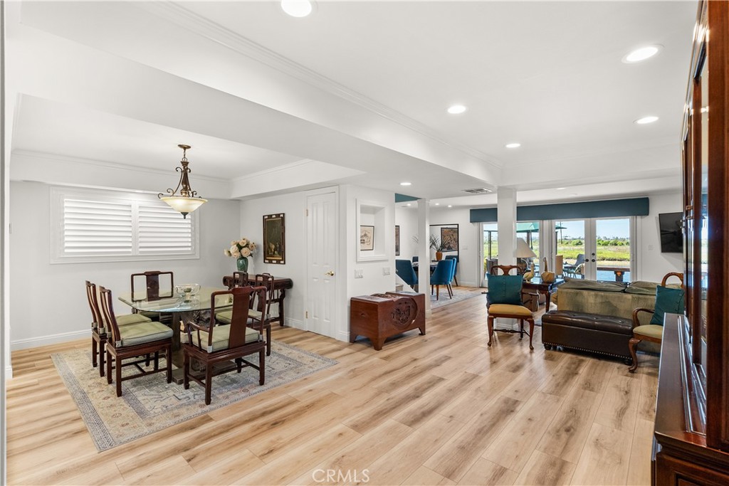 5 Canal Circle Newport Beach, CA 92663 - Photo 8 of 30 a view of a dining room with furniture window and wooden floor