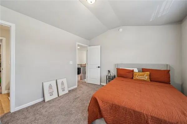 a bedroom with bed and window