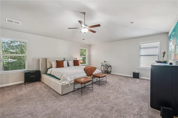 a bedroom with bed and window