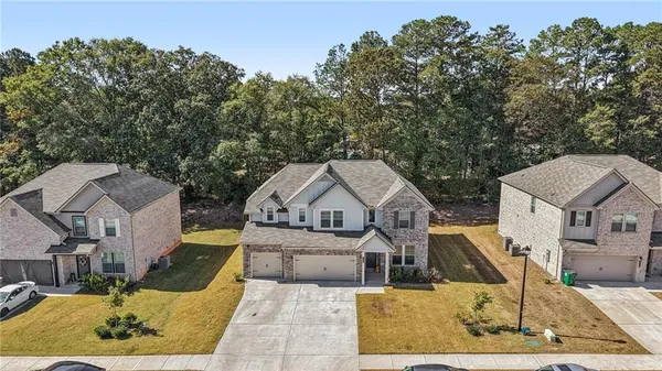 an aerial view of a house with swimming pool