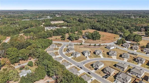 an aerial view of a house with a garden
