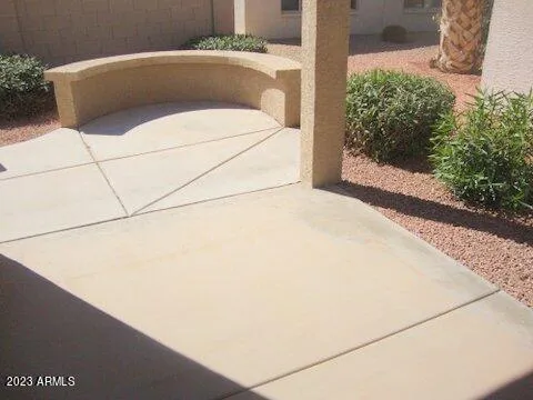 a white bed sitting in a backyard