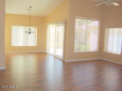 14845 West Merrell Street Goodyear, AZ 85395 - Photo 6 of 14 a view of a kitchen with wooden floor and a window