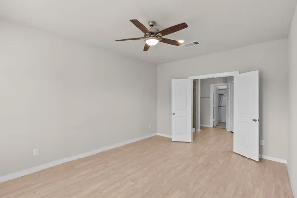 a view of an empty room with a window