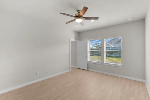 a bathroom with double vanity sinks and a mirror