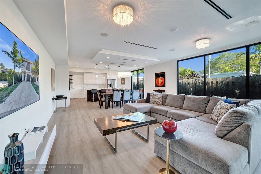 1238 Northeast 17th Avenue, Unit 2 Fort Lauderdale, FL 33304 - Photo 12 of 40 a living room with furniture and a large window