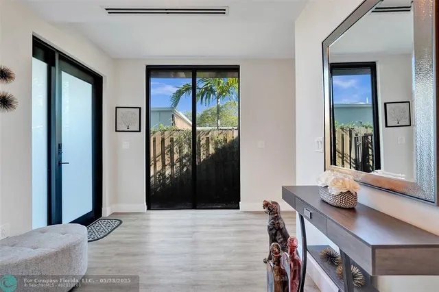 a view of a livingroom with furniture and front door