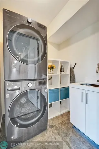 a en suite bathroom with a double vanity sink and a mirror