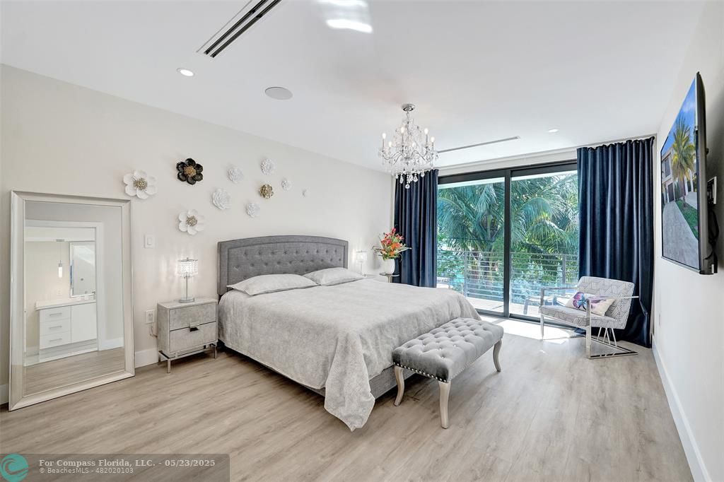 1238 Northeast 17th Avenue, Unit 2 Fort Lauderdale, FL 33304 - Photo 20 of 40 a spacious bedroom with a bed and a large window