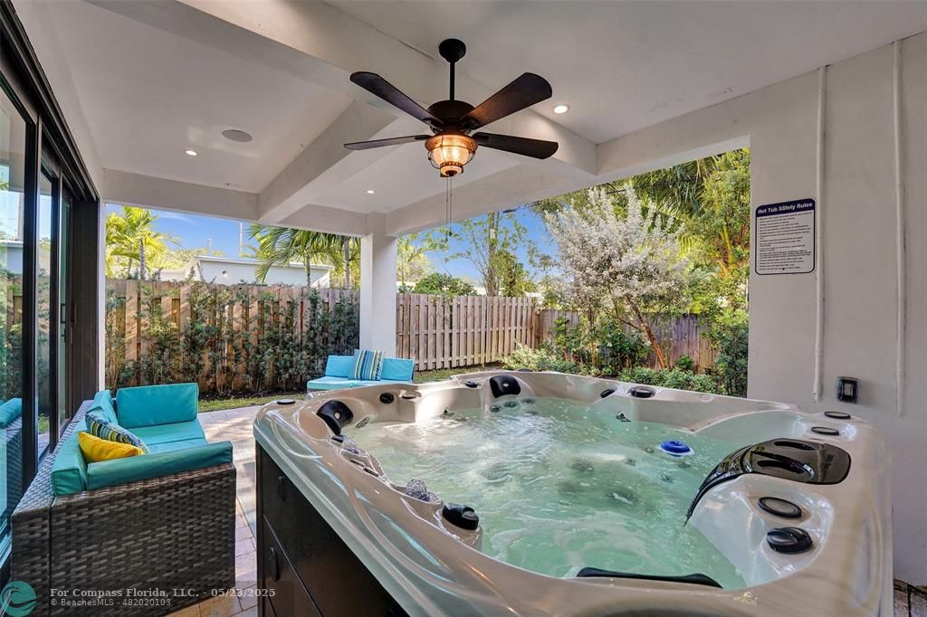 1238 Northeast 17th Avenue, Unit 2 Fort Lauderdale, FL 33304 - Photo 37 of 40 a bath tub sitting next to a window