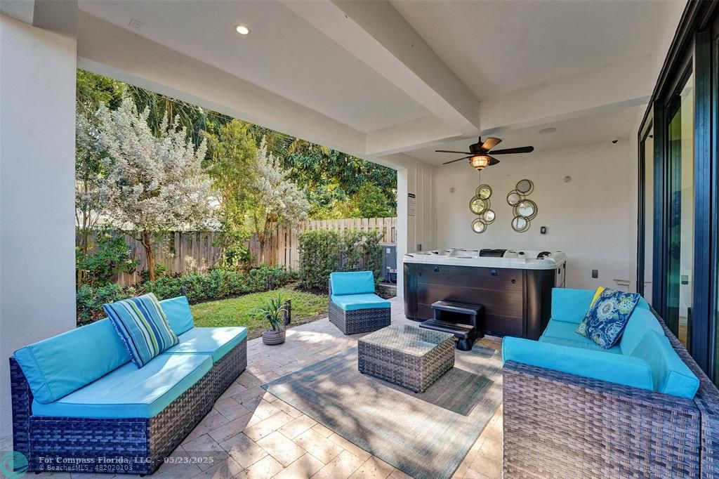 1238 Northeast 17th Avenue, Unit 2 Fort Lauderdale, FL 33304 - Photo 38 of 40 a living room with furniture and a fireplace