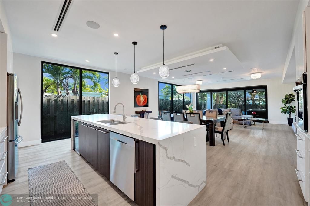 1238 Northeast 17th Avenue, Unit 2 Fort Lauderdale, FL 33304 - Photo 8 of 40 a kitchen with a sink and wooden floor