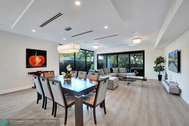 a view of a dining room with furniture window and outside view