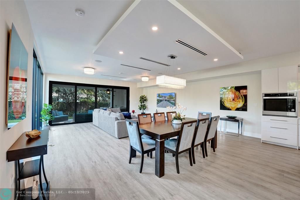 1238 Northeast 17th Avenue, Unit 2 Fort Lauderdale, FL 33304 - Photo 10 of 40 a view of a dining room with furniture window and wooden floor