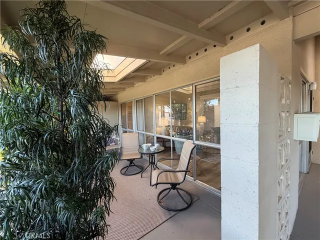 a view of a livingroom with furniture and a potted plant