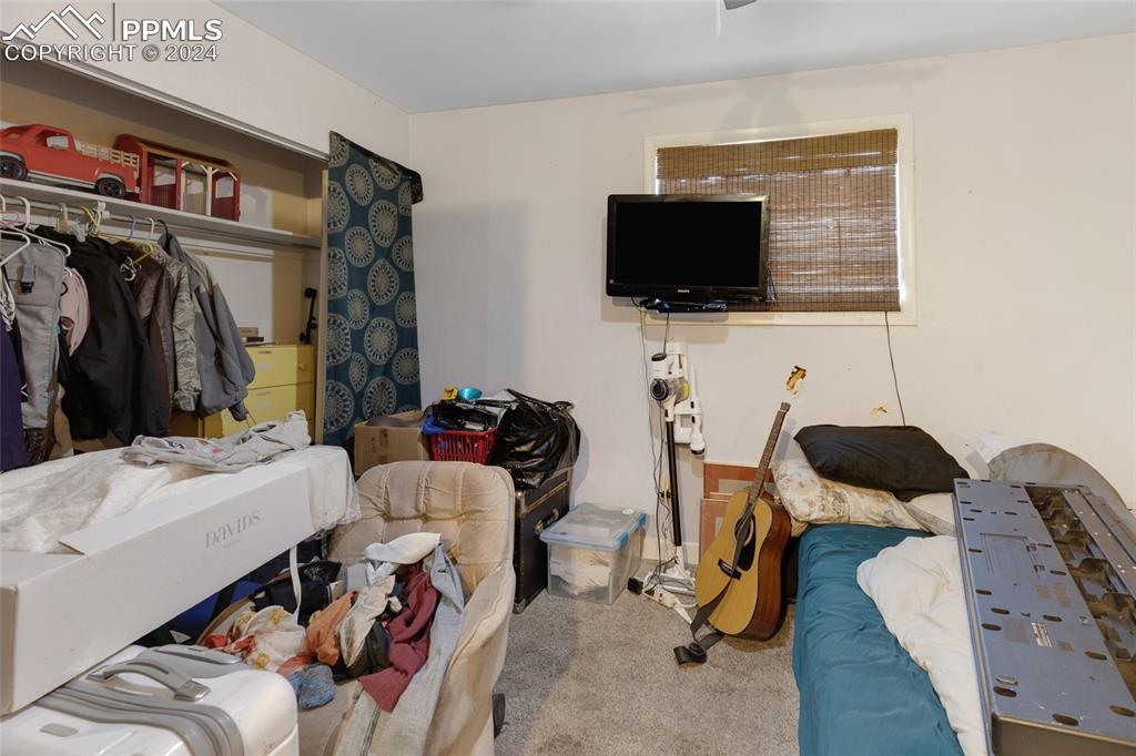 36865 Funk Road Calhan, CO 80808 - Photo 12 of 21 a living room with furniture and a flat screen tv