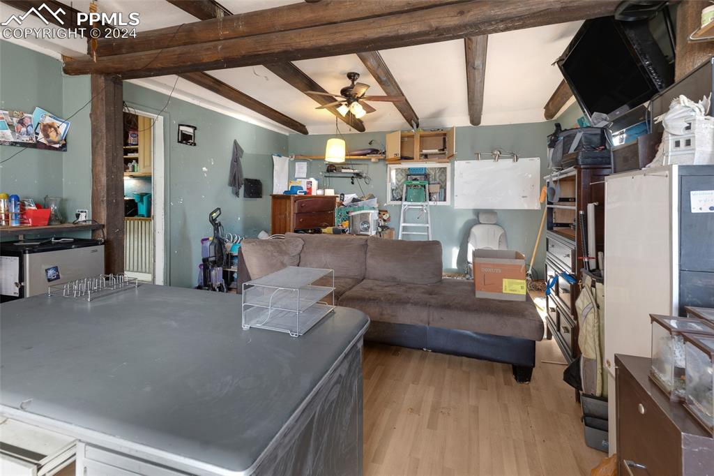 36865 Funk Road Calhan, CO 80808 - Photo 15 of 21 a living room with furniture and a flat screen tv