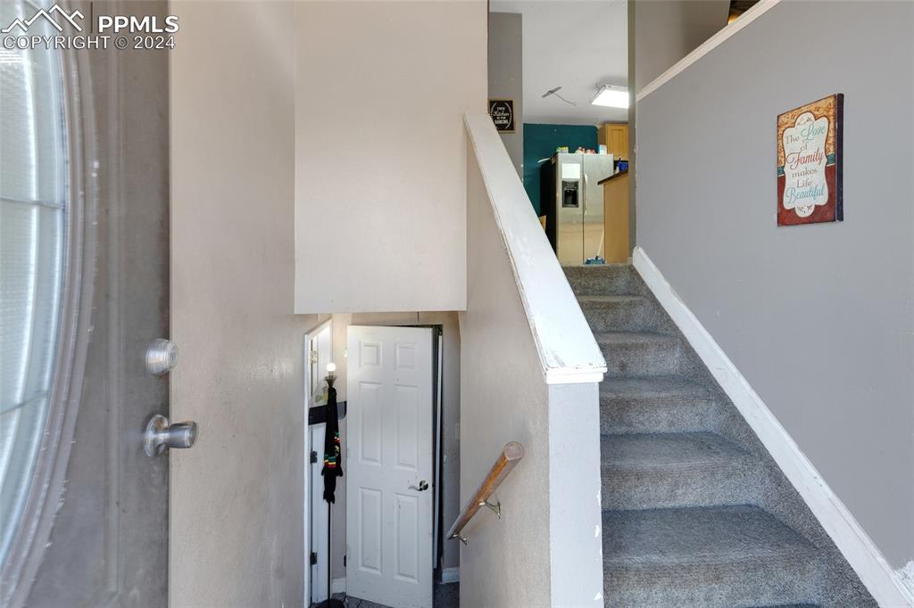 36865 Funk Road Calhan, CO 80808 - Photo 2 of 21 a view of a hallway with wooden floor and entryway