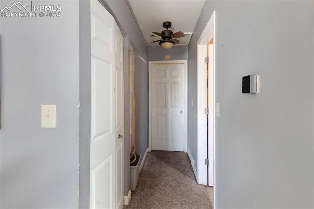 36865 Funk Road Calhan, CO 80808 - Photo 7 of 21 a view of a hallway with a door