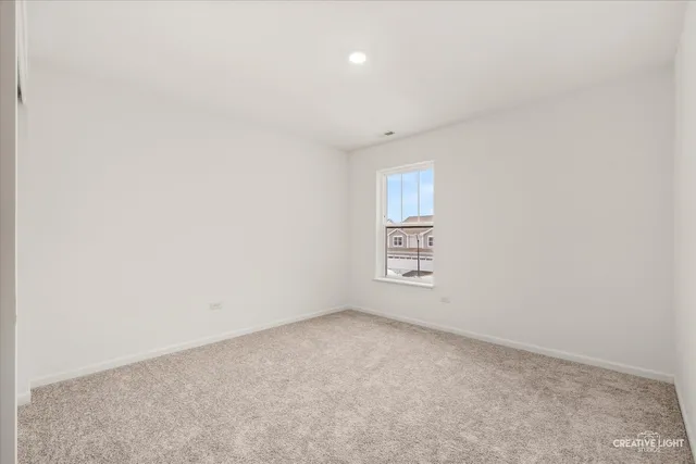 an empty room with a empty space and a window